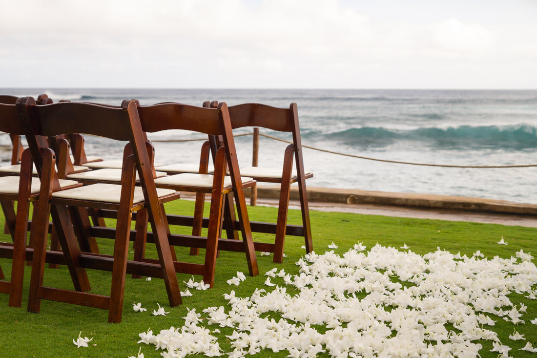 chairs set up foe wedding ceremony by the beach